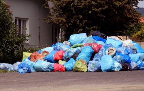 Collection crew preparing bins for commercial waste pickup